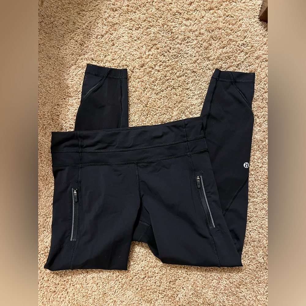 Lululemon Mid-rise double zipper mesh bottom leggings. Crop-7/8 length. Size 8.